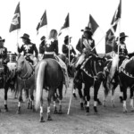 A flag parade at the start of the Mesquite Rodeo. Mesquite, TX